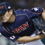 Japan's pitcher Tanaka pitches against Cuba at the WBC qualifying first round in Fukuoka